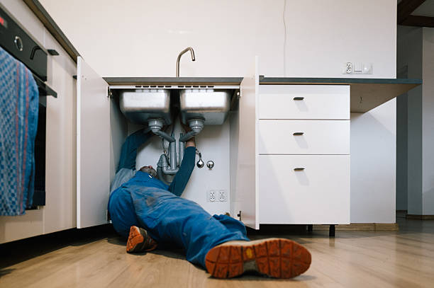 Professional Emergency Plumber technician working in Mc Donald, PA